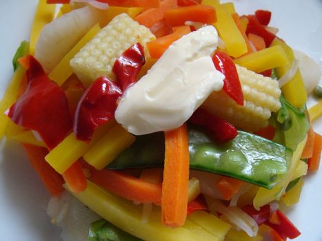 yummy plate of fresh vegetables dripping with butter