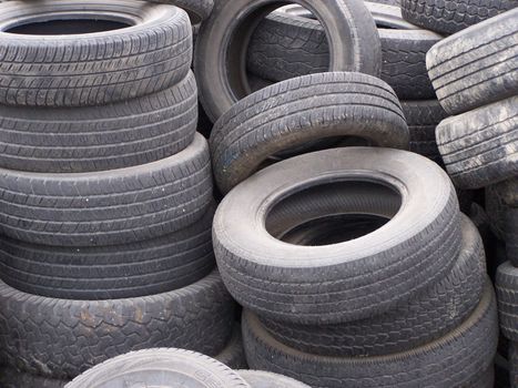 Shot of used tires piled