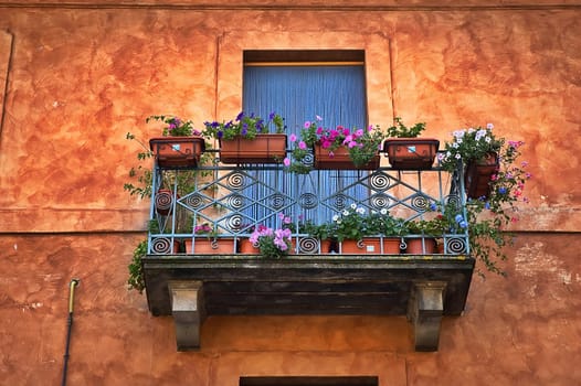 Italian balcony with vases and flowers