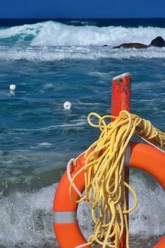 Beach life saver with rough sea and big waves in the background