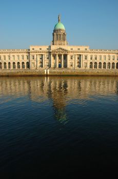 Custom House on the Quays in Dublin. A neoclassical 18th century building which now houses the Department of Environment, Heritage and Local Government. It is located on the north bank of the River Liffey, on Custom House Quay between Butt Bridge and Talbot Memorial Bridge.
It was designed by James Gandon to act as the new custom house for Dublin Port. When it was completed in 1791, it cost �200,000 to build � a huge sum at the time. The four facades of the building are decorated with coats-of-arms and ornamental sculptures representing Ireland's rivers.