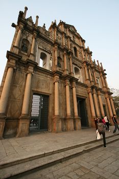 The famous ruins of St. Pauls Cathedral in Macau, a popular tourist attraction and a reminiscence of the old Portugese colonial rule.