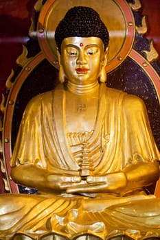 Image of a Buddha statue at Jian Zhen Temple, Yangshuo, Guilin, China.