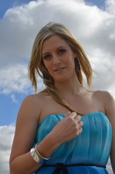Close up of attractive blond lady in her cocktail dress