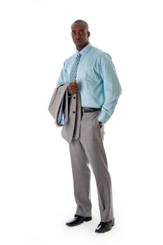 Handsome African American man in gray suit standing with hand in pocket and blazer over arm, isolated