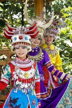 Image of young Chinese girls in traditional ethnic dress at Yao Mountain, Guilin, China.