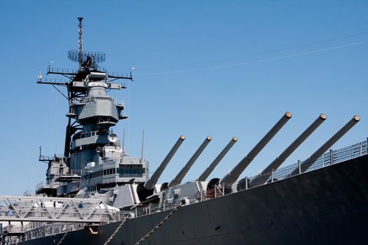 Turret barrels and control tower with radar on a US Navy military Iowa class battleship