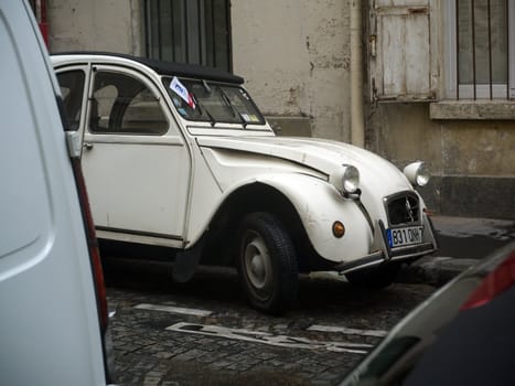 An old car on the street in Paris.