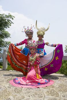 Image of young Chinese girls in traditional ethnic dress at Yao Mountain, Guilin, China.