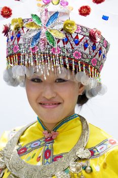 Image of a young Chinese girl in traditional ethnic dress at Yao Mountain, Guilin, China.