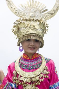 Image of a young Chinese girl in traditional ethnic dress at Yao Mountain, Guilin, China.