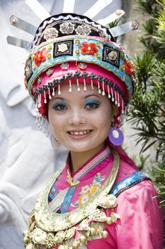 Image of a young Chinese girl in traditional ethnic dress at Yao Mountain, Guilin, China.