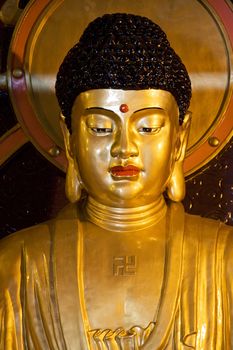 Image of a Buddha statue at Jian Zhen Temple, Yangshuo, Guilin, China.