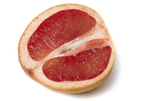 Pink grapefruit halve isolated on white background