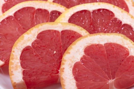 Sliced grapefruit background. Macro photo