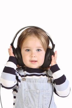 beauty a little girl listening music on white background