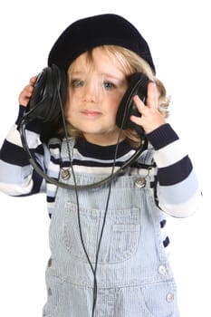 beauty a little girl listening music on white background