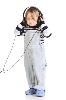 beauty a little girl listening music on white background