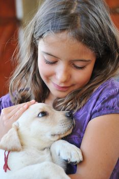  purebred puppy labrador retriever  and smiling little girl