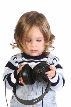 beauty a little girl listening music on white background