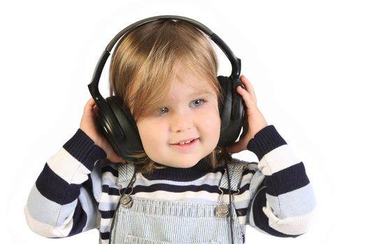 beauty a little girl listening music on white background