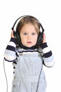 beauty a little girl listening music on white background