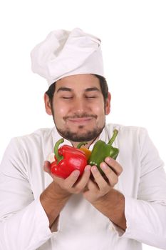 chef smelling the aroma of fresh peppers