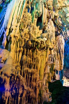 Image of stalactite and stalagmite formations all lighted up at Reed Flute Cave, Guilin, Guangxi Zhuang Autonomous Region, China.