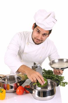 young chef preparing lunch on white background