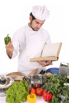 young chef preparing lunch on white background