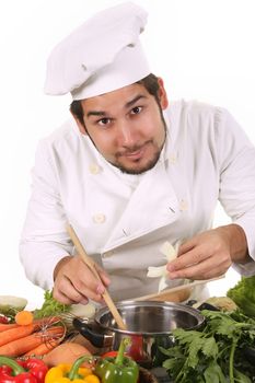 young chef preparing lunch on white background