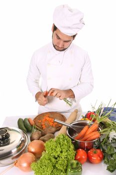 young chef preparing lunch on white background