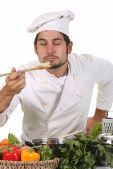 young chef smelling the aroma delicious food