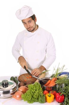 young chef preparing lunch on white background