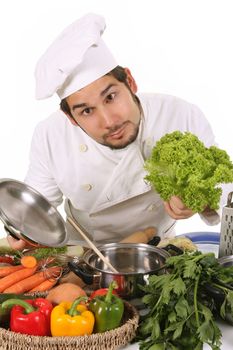 young chef preparing lunch on white background