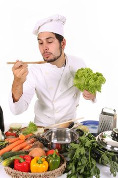 young chef preparing lunch on white background