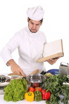 young chef preparing lunch on white background