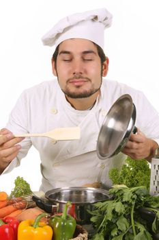 young chef smelling the aroma delicious food