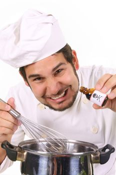 young chef preparing lunch with poison bottle