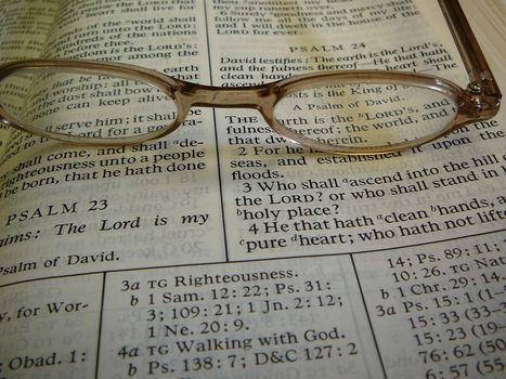 Open Book Of Mormon with glasses on top