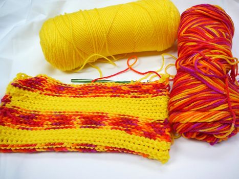 Skeins of warm colored yarn