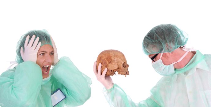 surgeon with skull and shouting shocked healthcare worker