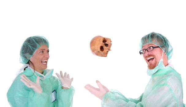 surgeon with skull and shouting shocked healthcare worker