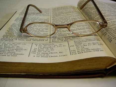 Open Book Of Mormon with glasses on top