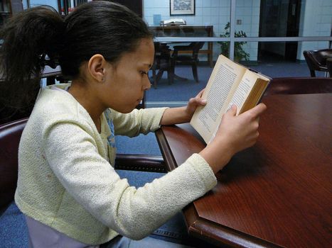 Girl Reading in the library