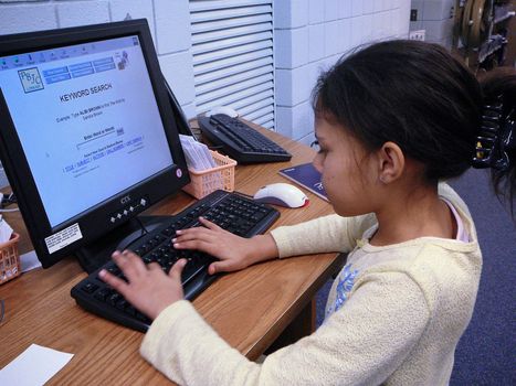 Girl using library computer