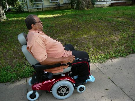 Senior gentleman riding scooter