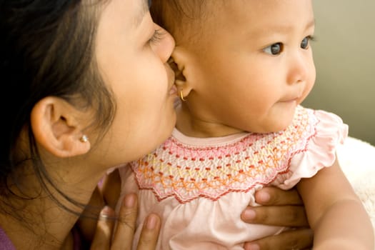 a mother expressing her love to her 10 months old baby girl