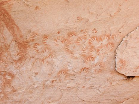 Historic Anasazi hand prints on sandstone surface in White Canyon, Utah, USA.