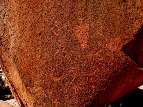 Historic Anasazi petroglyphs on huge sandstone boulder in Step Canyon, Utah, USA.